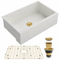 White quartz composite kitchen sink with gold bottom grid and gold drain assembly