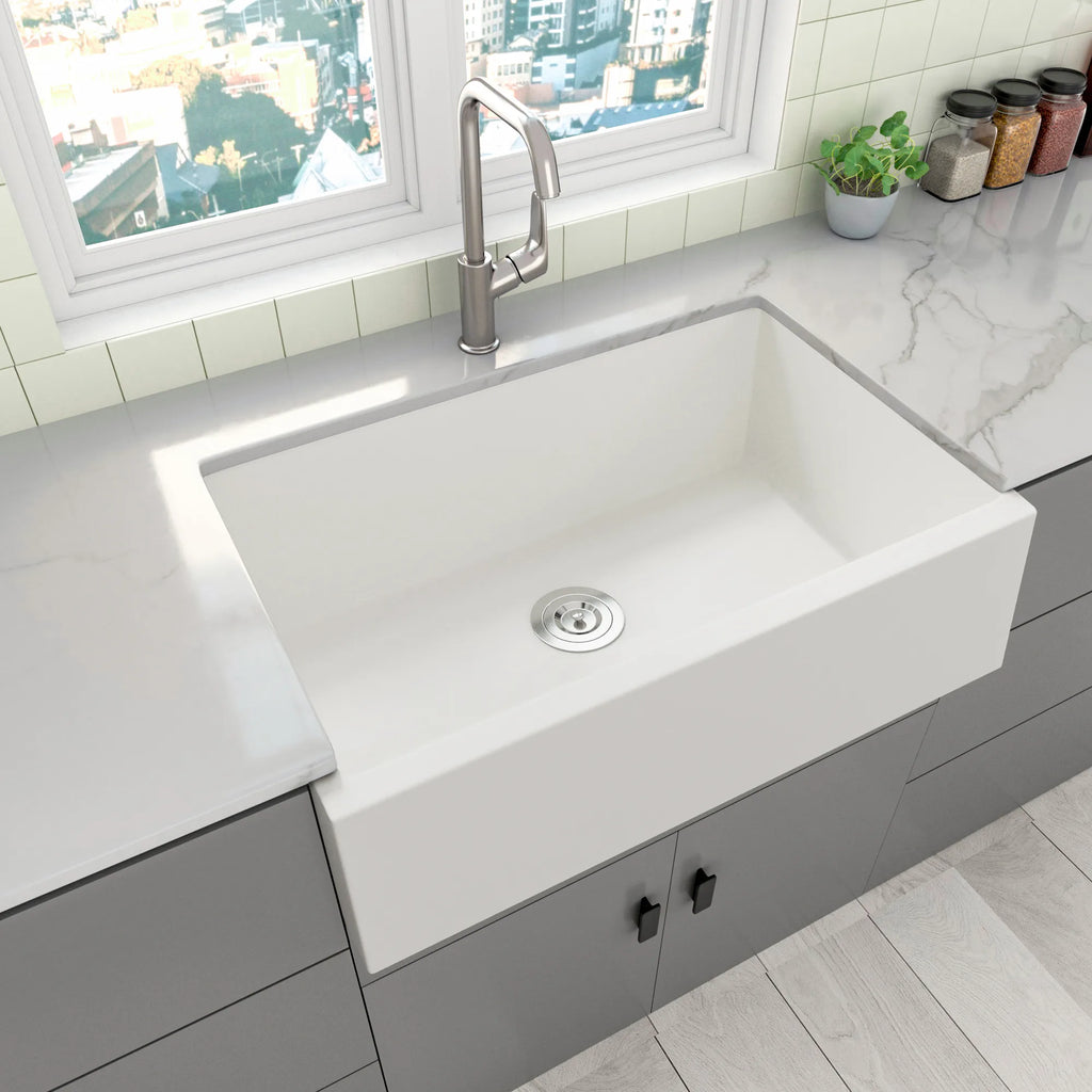 White quartz composite apron front sink with center drain
