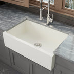 White quartz composite apron front kitchen sink in a kitchen