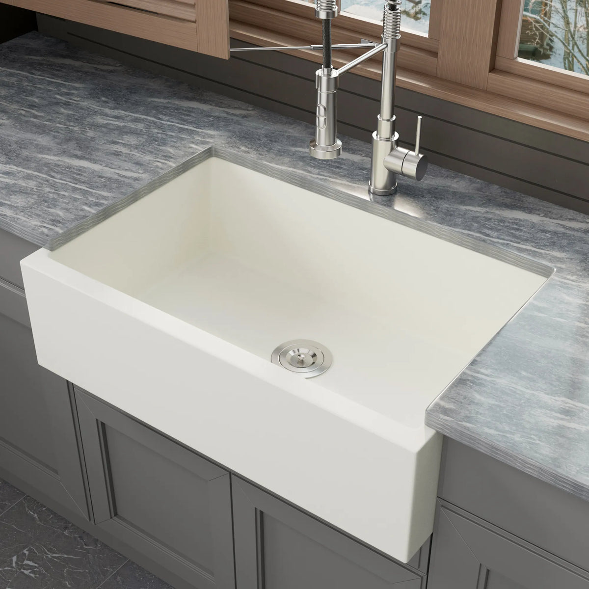 White quartz composite apron front kitchen sink in a kitchen