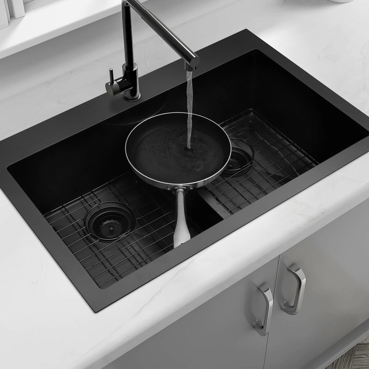Black double bowl kitchen sink washing a large pan