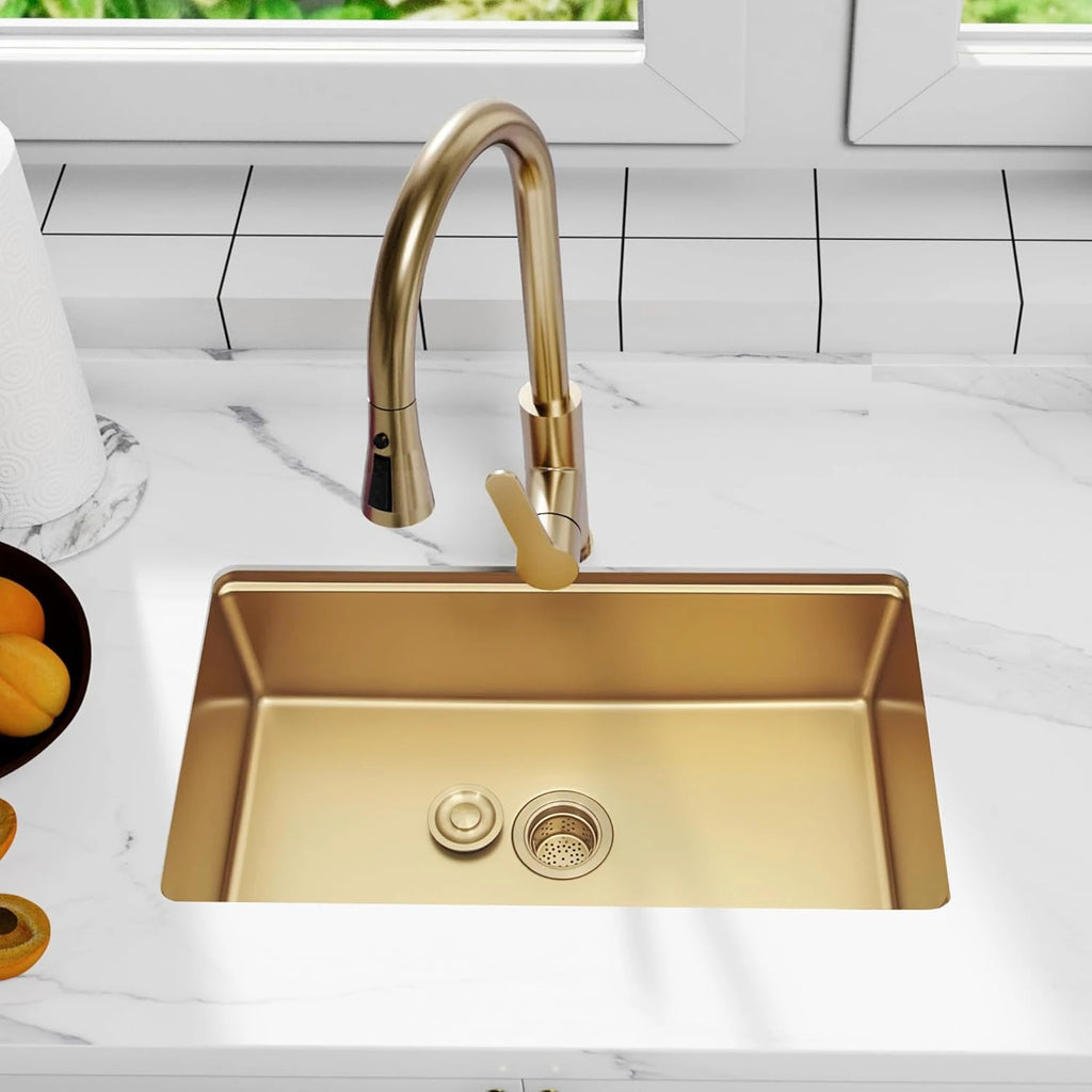 Gold kitchen sink drain installed in a gold kitchen sink
