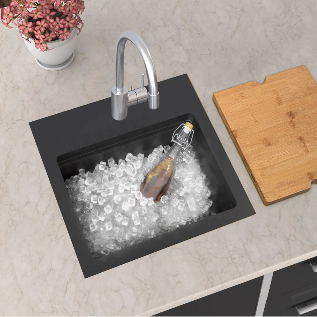 Black 15 inch topmount bar sink used as an ice bucket