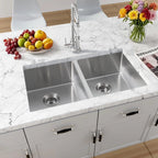 32 inch stainless steel dual-mount double bowl kitchen sink installed in a marble countertop
