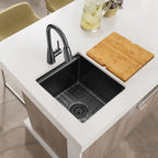 Black undermount workstation bar sink installed with bottom grid