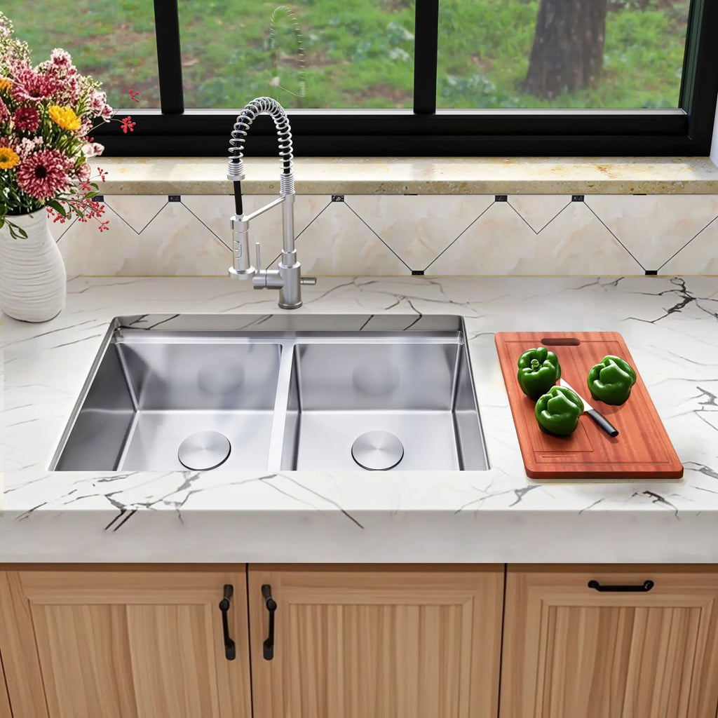 Front view of stainless steel double bowl kitchen sink installed in countertop
